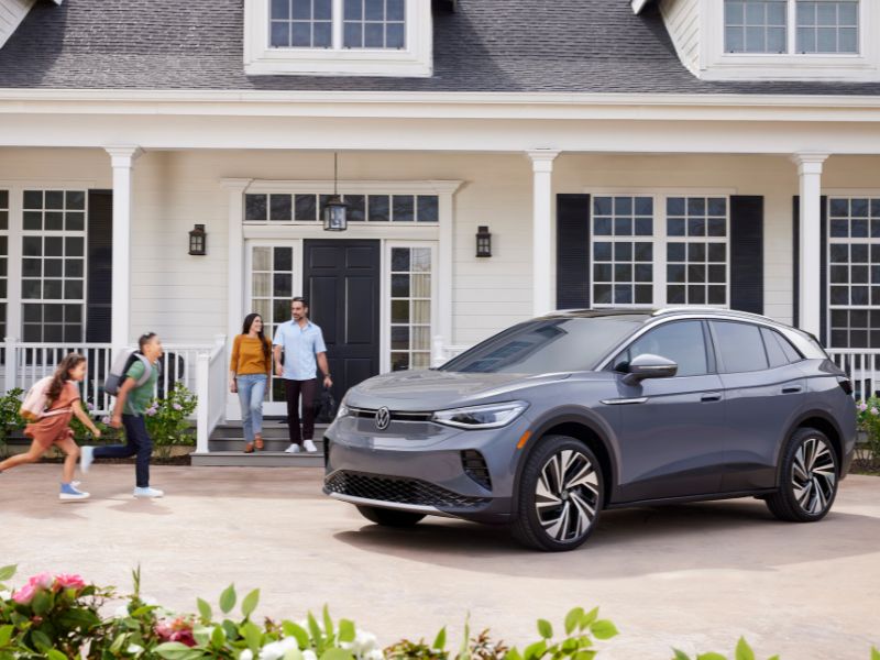 a photo of a family about to get into the electric Volkswagen ID.4